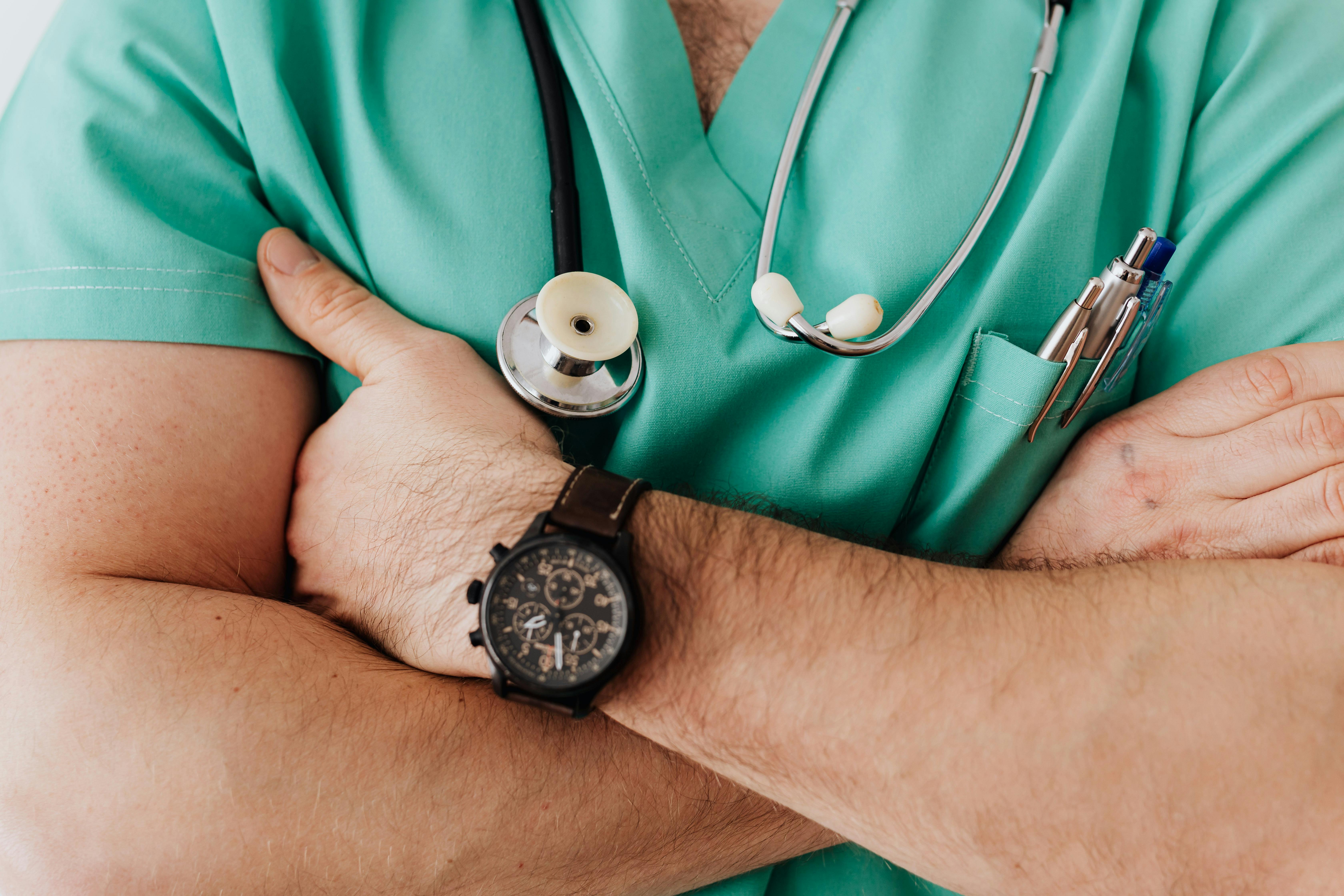 GP doctor consulting with patient